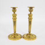 Pair of fire-gilded Empire candlesticks