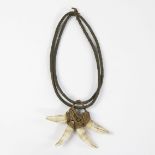 African tribal necklace with crocodile teeth