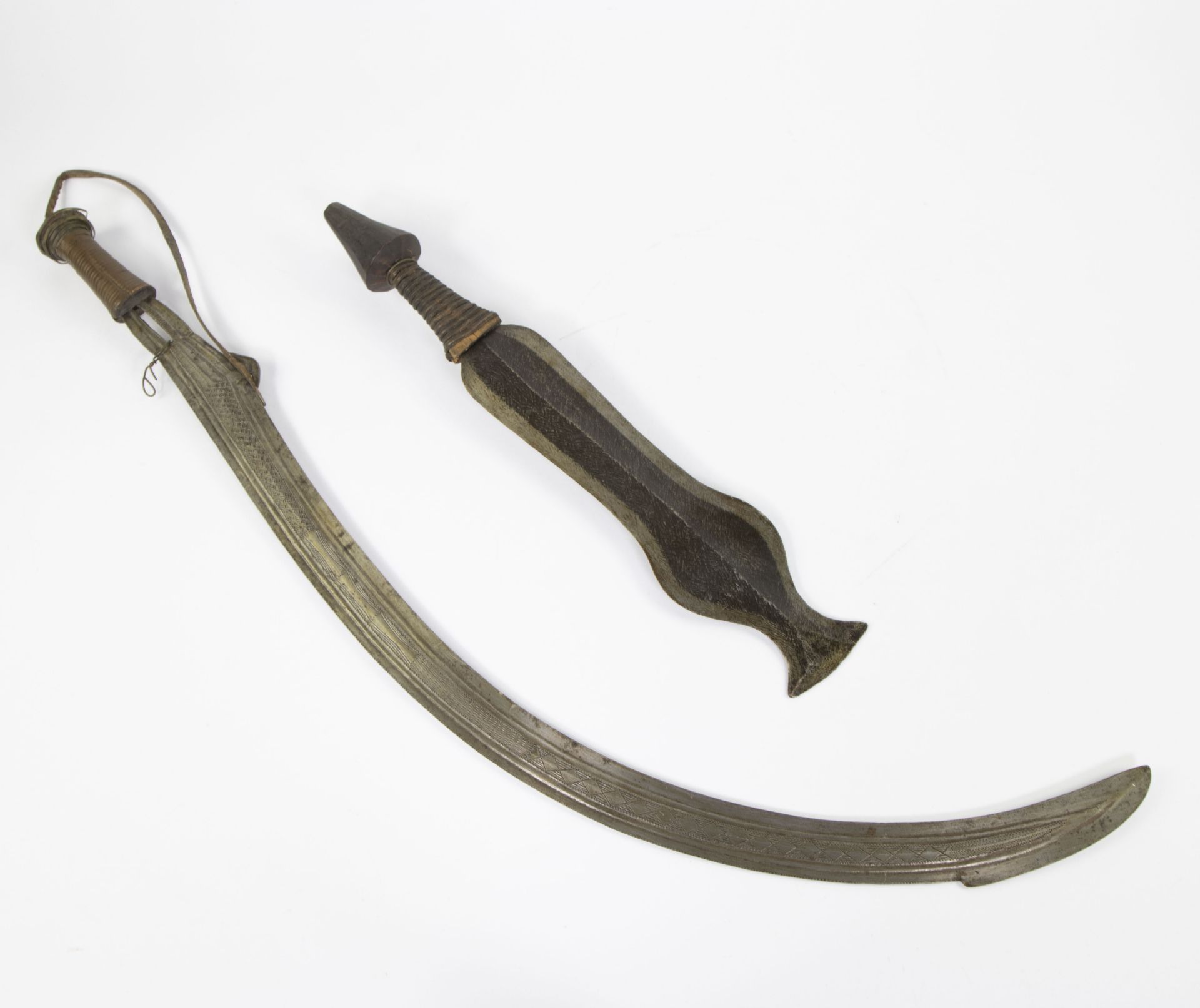 Collection of an African forged hand waepen and a scimitar