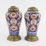 Couple Imari vases with brass mounts