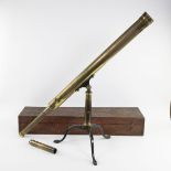 A George III brass telescope in original wooden case