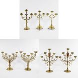 A collection of neo-gothic church candlesticks (7) in brass