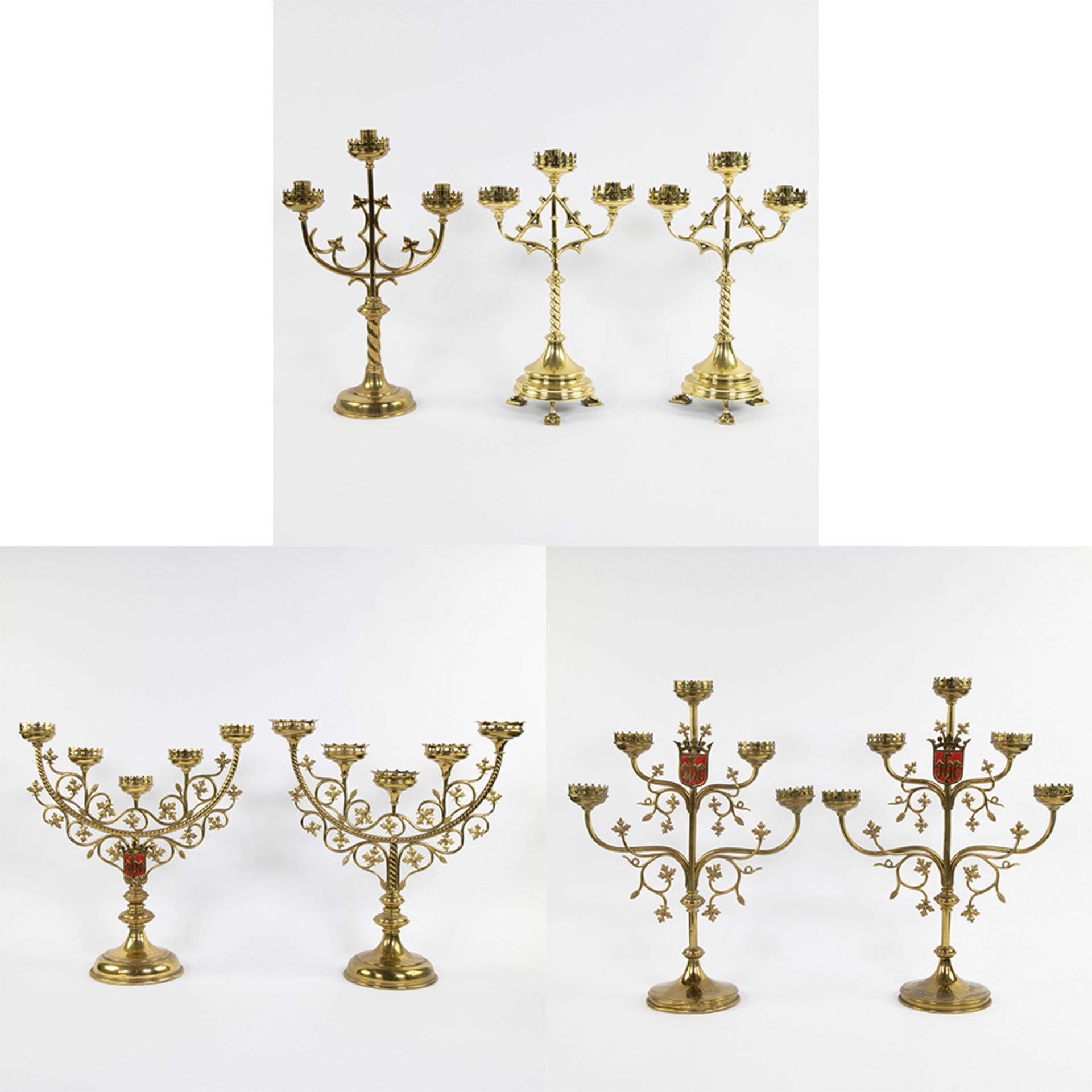 A collection of neo-gothic church candlesticks (7) in brass