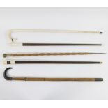 Collection of 5 walking sticks with one hidden sword cane