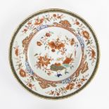 Chinese plate 18th century, polychrome porcelain with lotus, tobacco leaf, valuables and Lingzhi