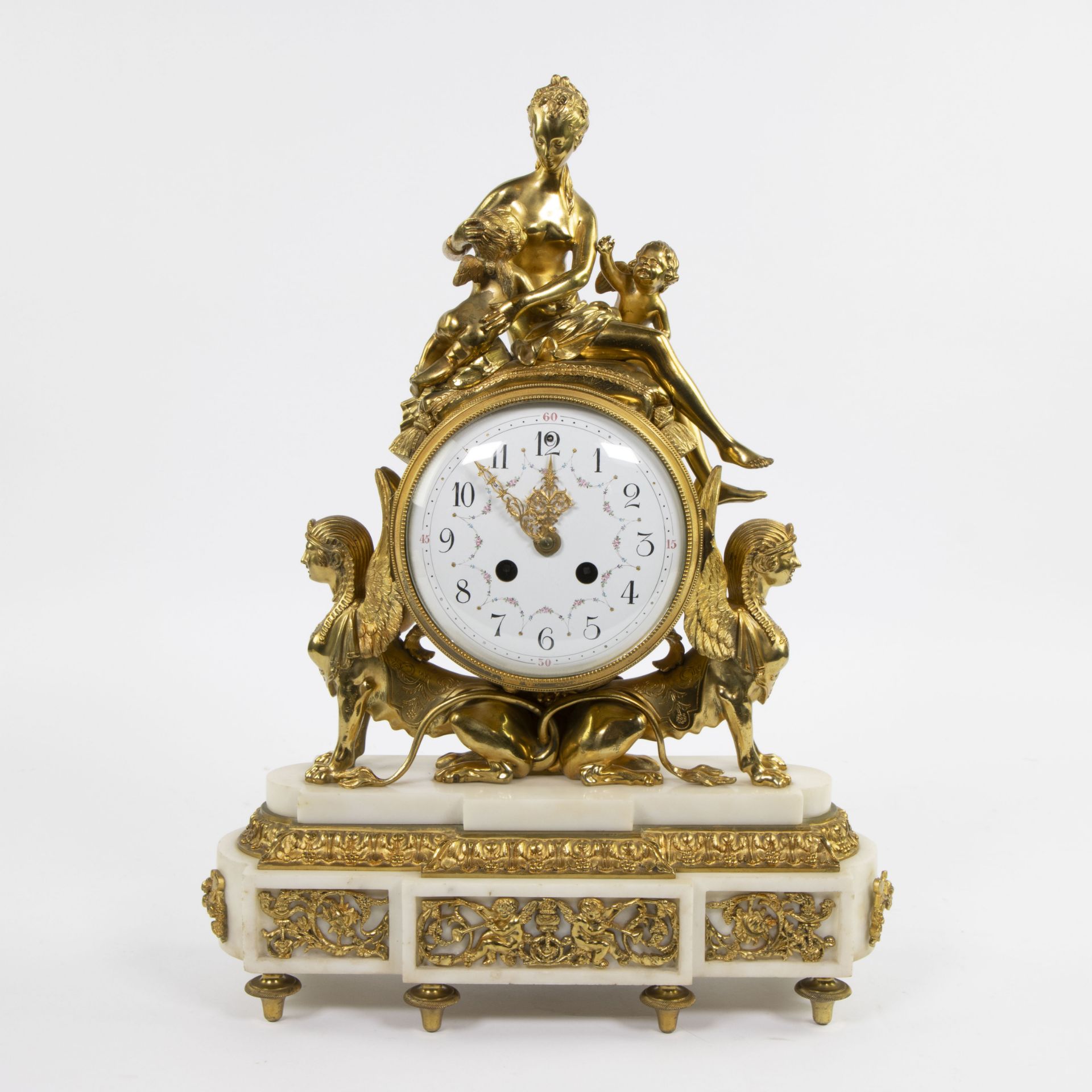Louis XVI pendulum in white marble and gilded bronze
