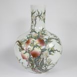 Chinese vase with peaches, porcelain painted with colored enamels.