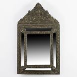 Stunning antique French cushion mirror with ornate repousse brass decoration, end 19th century.