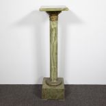 Green veined onyx column with bronze fittings and rotating top