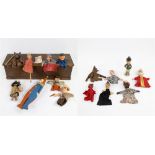 Wooden box with old vintage hand puppets and standing figure