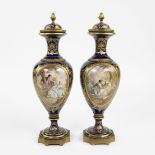 A pair of French handpainted Sèvres vases by Chanèle, signed and marked.