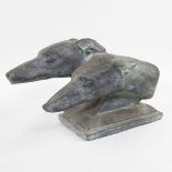 Stone sculpture of greyhound heads