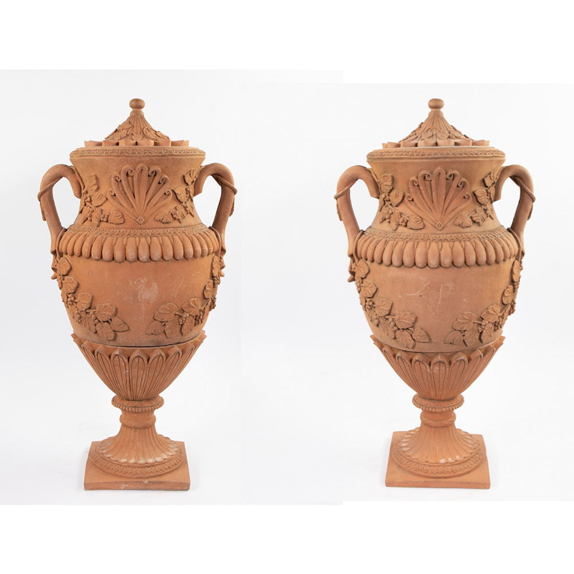 Pair of large 19th century terracotta garden vases decorated with leaf motifs