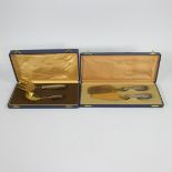 2 boxes with gold-plated cutlery
