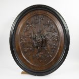 Wooden bas-relief with very finely sculpted floral motifs and a snipe in an ebonised frame, 19th cen