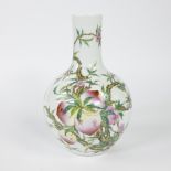 Chinese vase with peaches, porcelain painted with colored enamels.