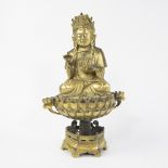Bronze gilded Buddha with outstretched handon a lotus pedestal