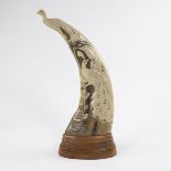 Very finely sculpted horn in the shape of a peacock with peacock motif