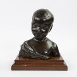 Bronze bust of a child on marble base, not signed.