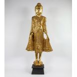Large gilded standing wooden Buddha statue