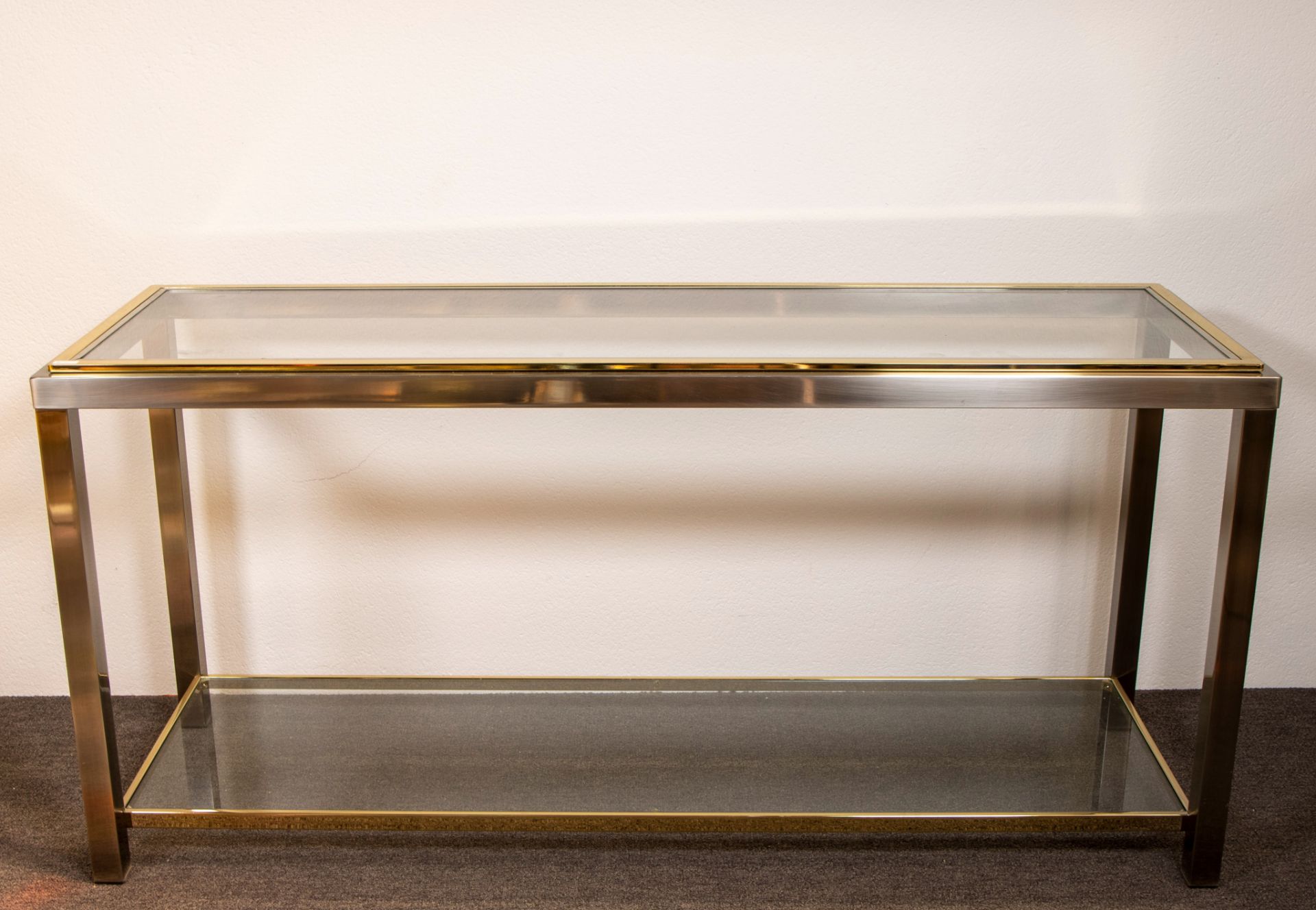Belgo Chrom console, steel and brass with clear glass