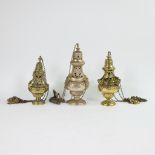 A collection of 3 incense burners