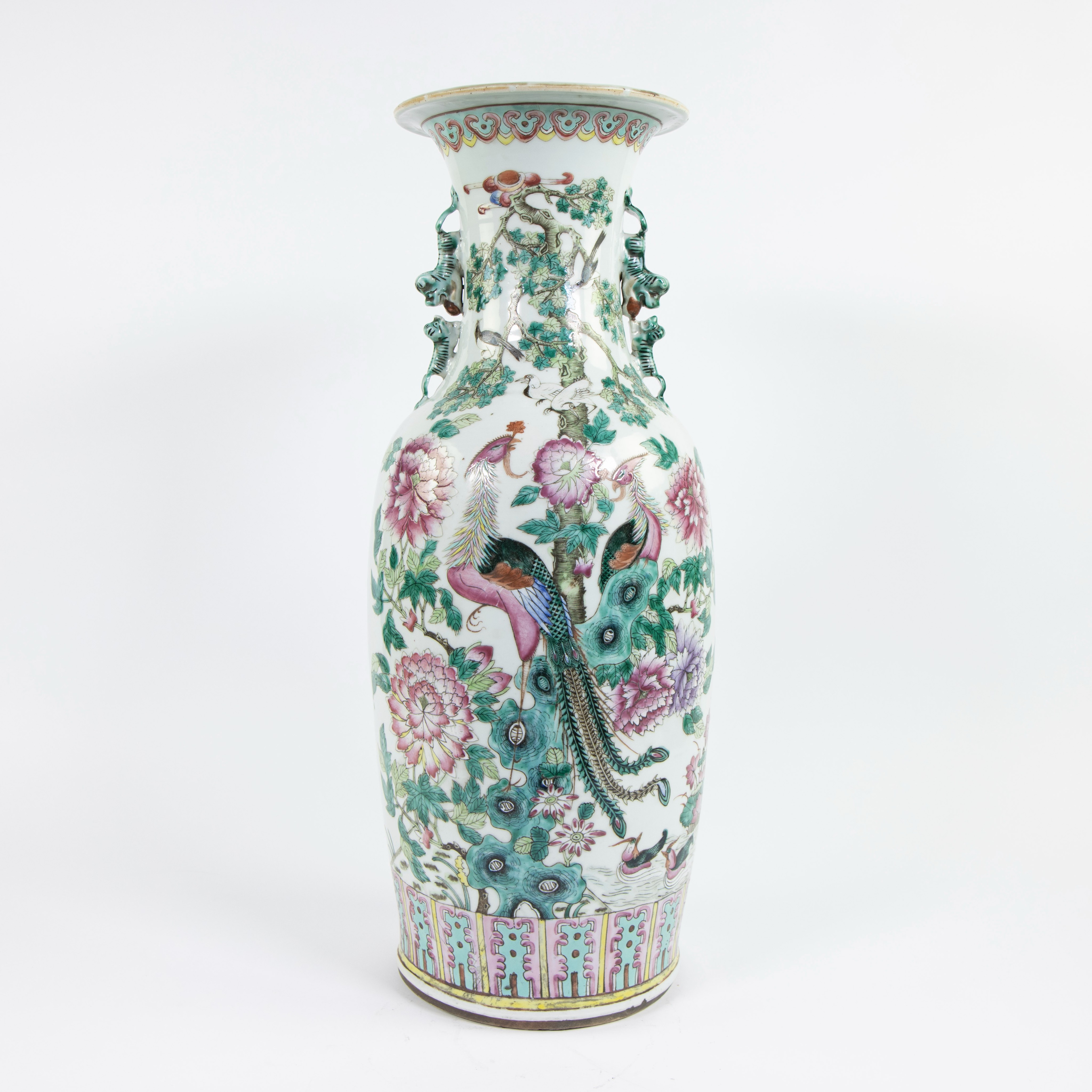 A fine Chinese famille rose baluster vase with birds, trees, peonis, blossoming prunes and foo lions