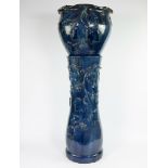 Plant stand in blue glazed ceramic decorated with leaf motifs