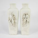 Pair of biscuit vases with a romantic angel scene in relief, signed d'après W. Bouguereau