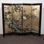 Chinese folding screen with elaborate floral motifs on a gold background