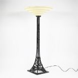 Art Deco floor lamp with wrought iron base and glass coupe
