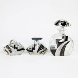 3 Art Deco perfume bottles with stylized geometric decor