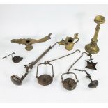 A collection of iron oil lamps