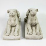 Pair of Reclining dogs in stone (cast)