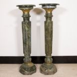 Pair of green-veined marble columns with bronze fittings