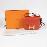 Hermes leather handback model Constance coral color with original bag and box