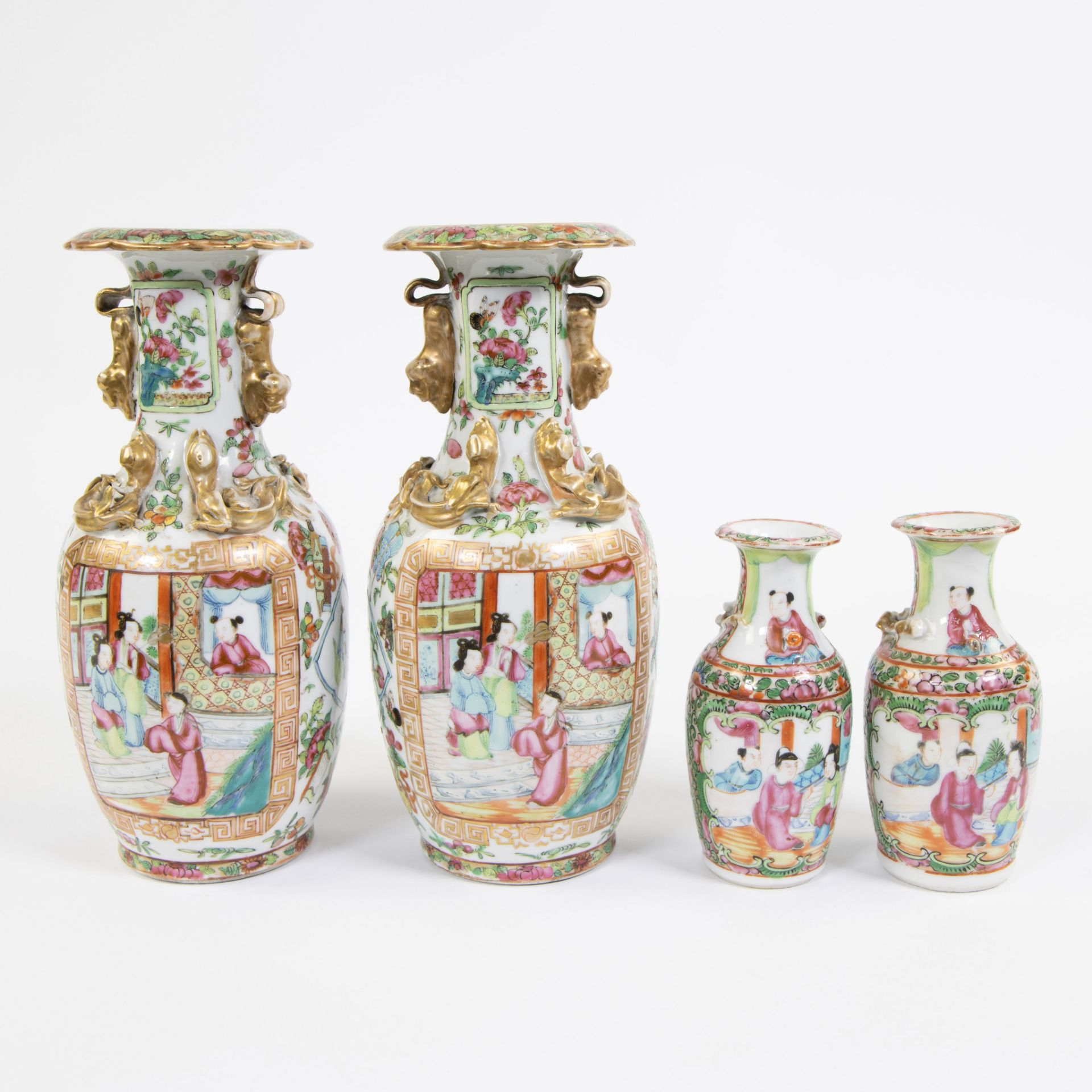 Two Canton porcelain vases and two smaller vases. Decorated in famille rose enamels enhanced with go