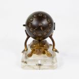 Paperweight composed of a clock in bronze on a tortoiseshell on a crystal base. French, late 19th ce