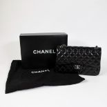 Chanel vintage model 2.55 crafted from lambskin in black with original bag and box