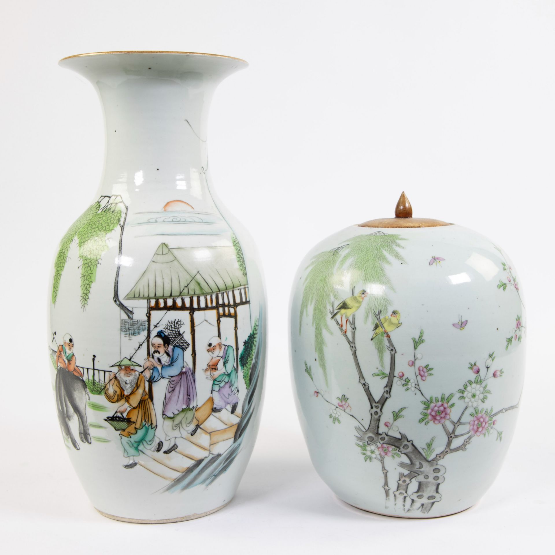 A porcelain ginger jar and a baluster vase, the latter depicting a rural scene. China, republic peri