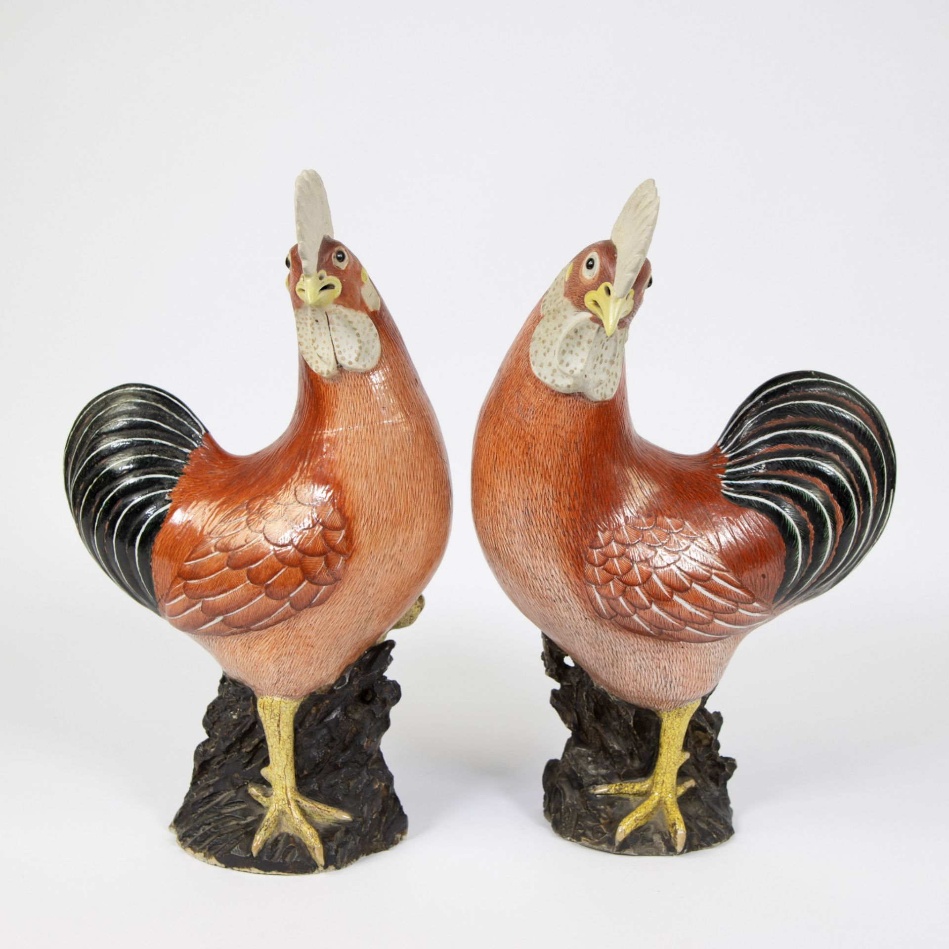 Pair of Chinese ceramic roosters, finely painted in reddish brown, 18th century Kangxi