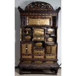 A superb large Shodana cabinet with gold lacquered panels and doors, with open carved crest and frie