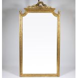 Gilded wooden wall mirror decorated with garlands