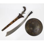 An Indonesian keris, a klewang and a shield