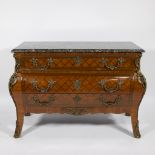 A French Louis XV style marquetry chest of drawers with marble top and gilt bronze mounts.