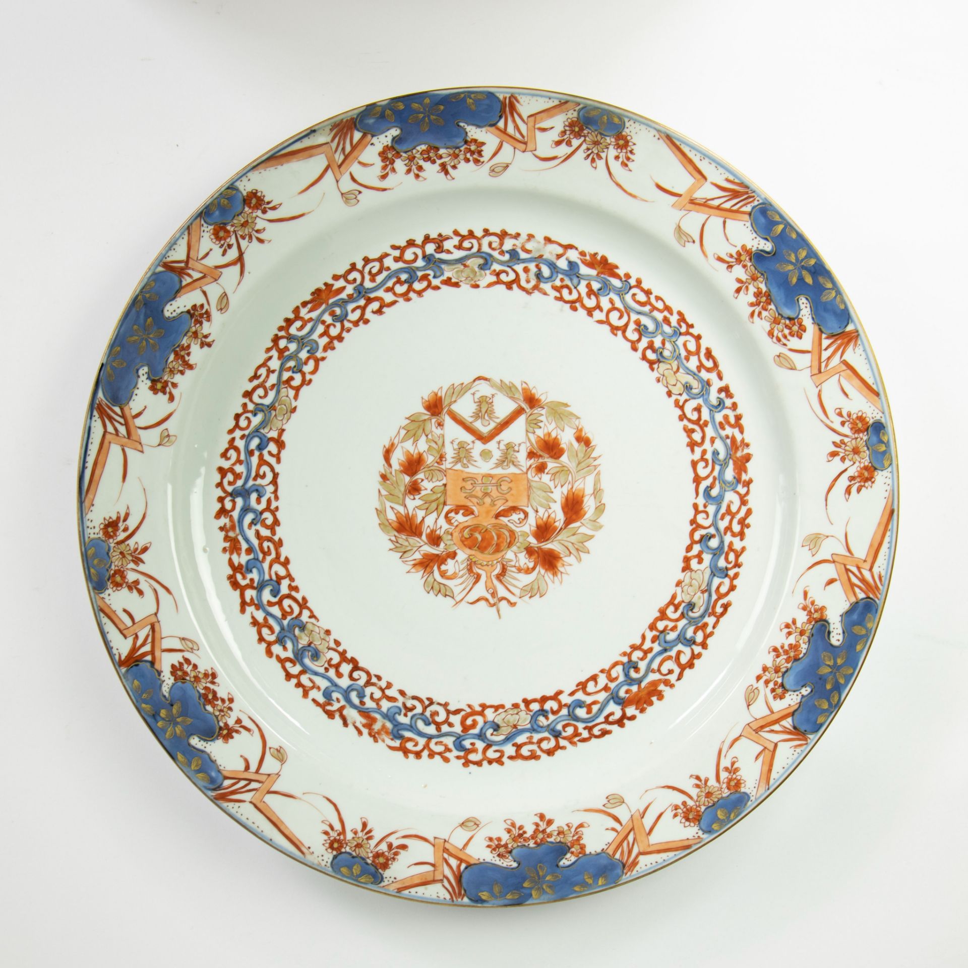 Large Chinese imari export porcelain armorial plate, the central coat of arms captured in a border o