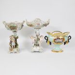 2 table pieces made of multicolored painted porcelain. Gondola-shaped openwork coupe, one of which r