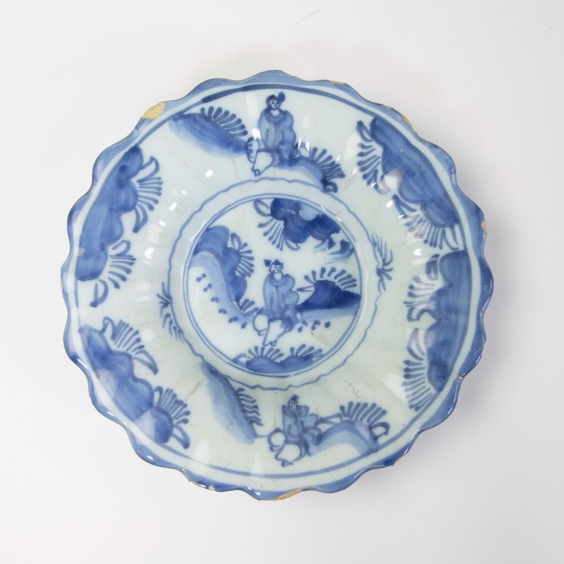 A Delft blue and white gadrooned chinoiserie dish, 17th C and 2 blue and white plates. - Image 2 of 7