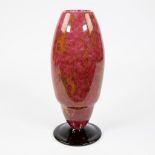 Conical Schneider vase flameworked yellow and pink powdered glass on a violet-black foot, signed Sch