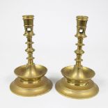 Pair of antique Dutch three-button candlesticks in brass.